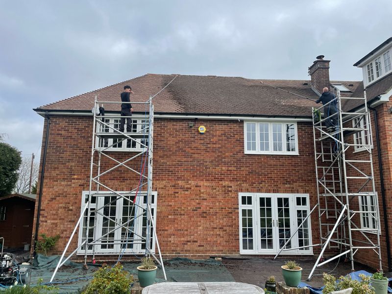 Roof cleaning carried out safely from scaffold towers by The Roof Moss Cleaners in Tewkesbury